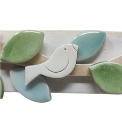 Cornice uccellino ceramica